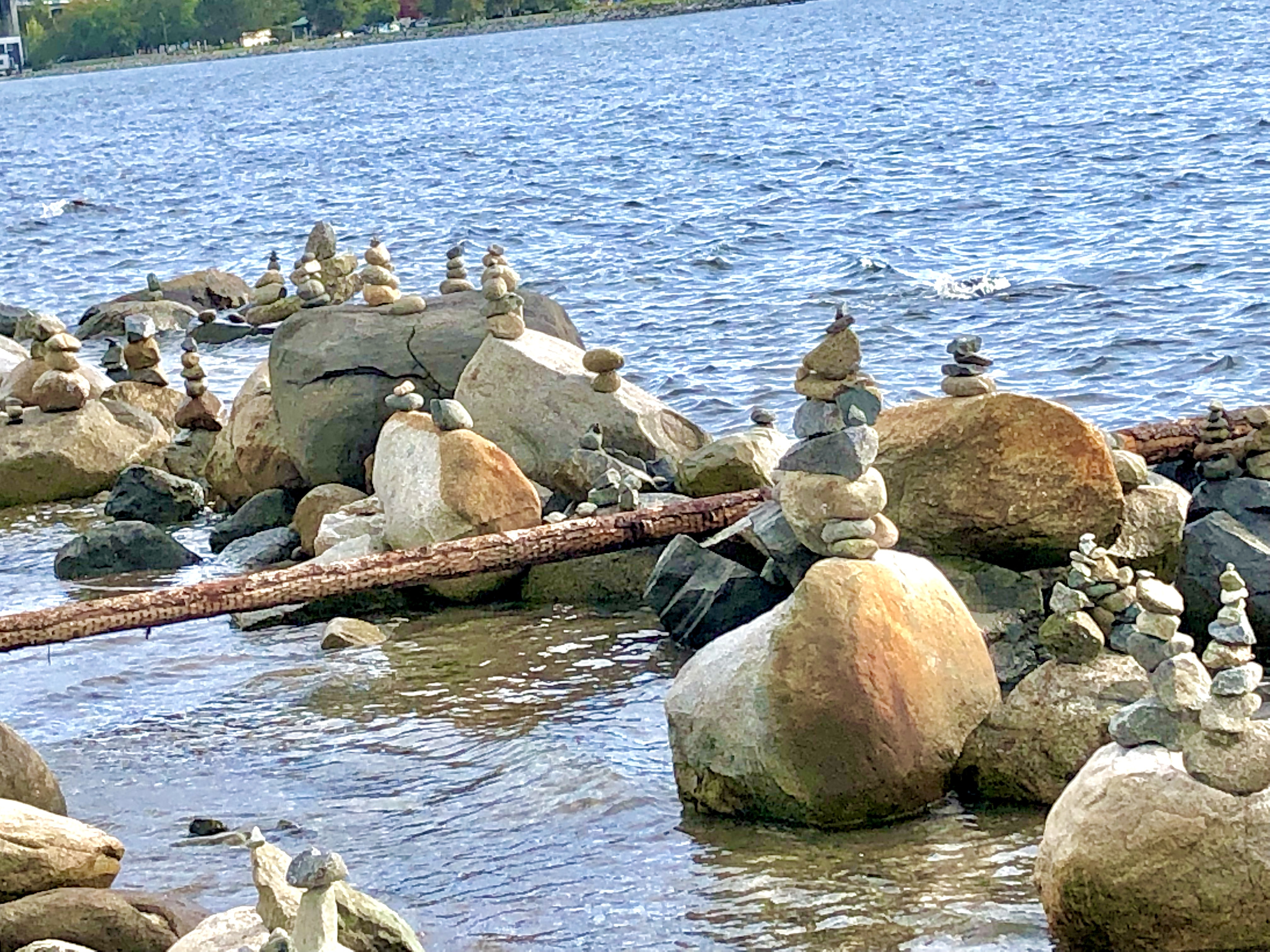 cairns on a beach by the ocean